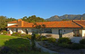 1301 Las Alturas Road Santa Barbara, CA 93103 - Photo 1 of 5 a view of a house with a garden and a yard