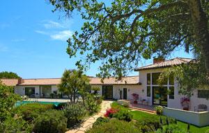 1301 Las Alturas Road Santa Barbara, CA 93103 - Photo 2 of 5 a front view of a house with garden
