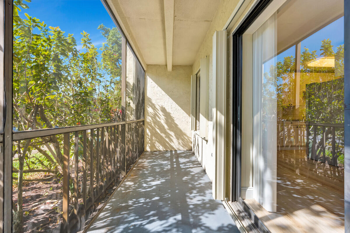 150 Pineview Road, Unit L3 Jupiter, FL 33469 - Photo 12 of 12 a view of entryway with wooden floor