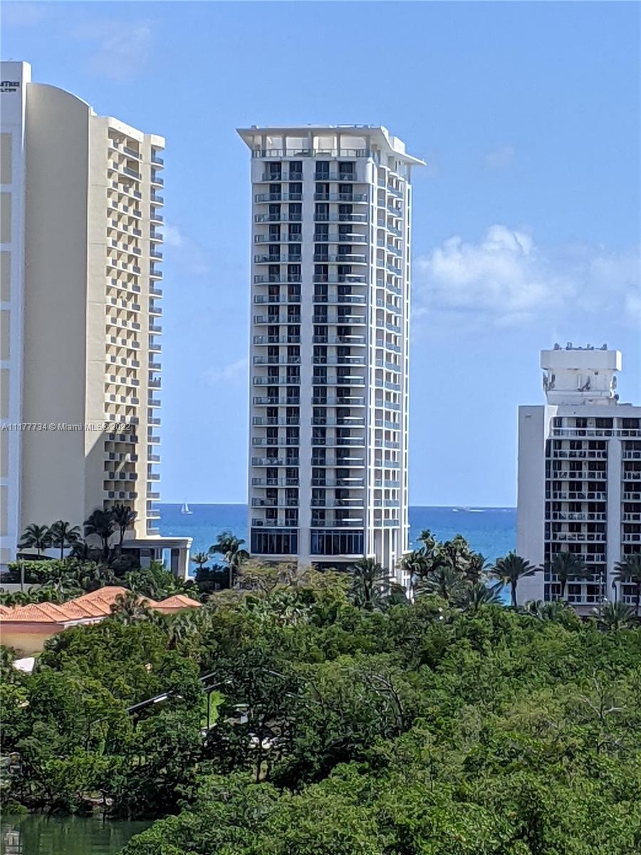 17150 North Bay Road, Unit 2814 Sunny Isles Beach, FL 33160 - Photo 17 of 25 a view of a building with a yard