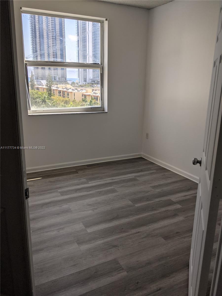 17150 North Bay Road, Unit 2814 Sunny Isles Beach, FL 33160 - Photo 23 of 25 an empty room with a window