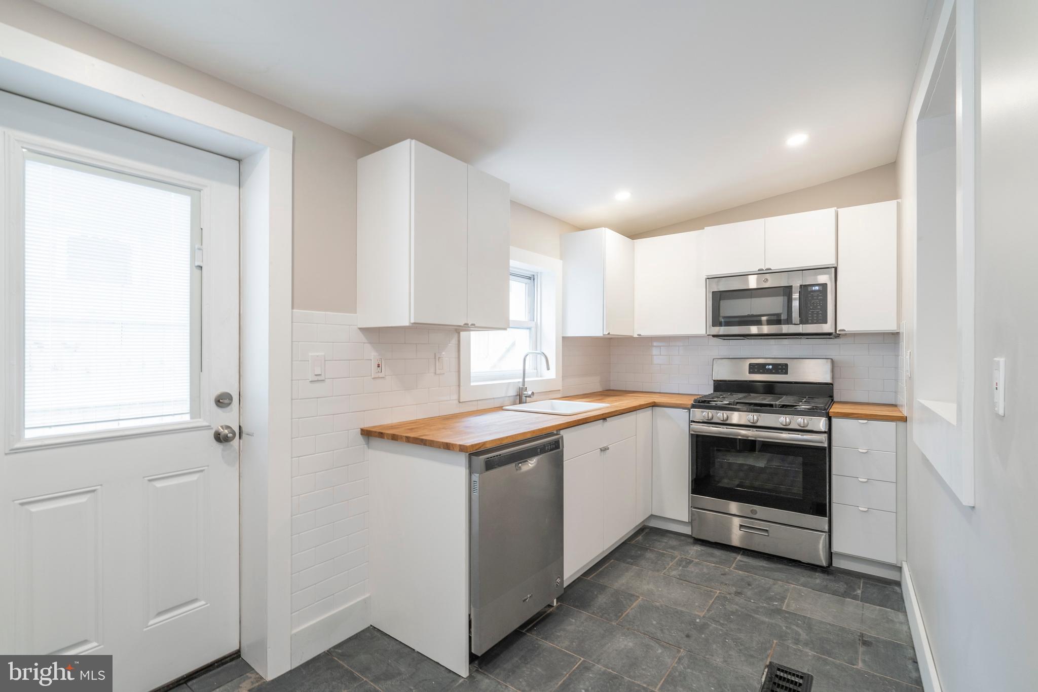 4507 Ritchie Street Philadelphia, PA 19127 - Photo 11 of 26 Kitchen with new exterior door to rear patio