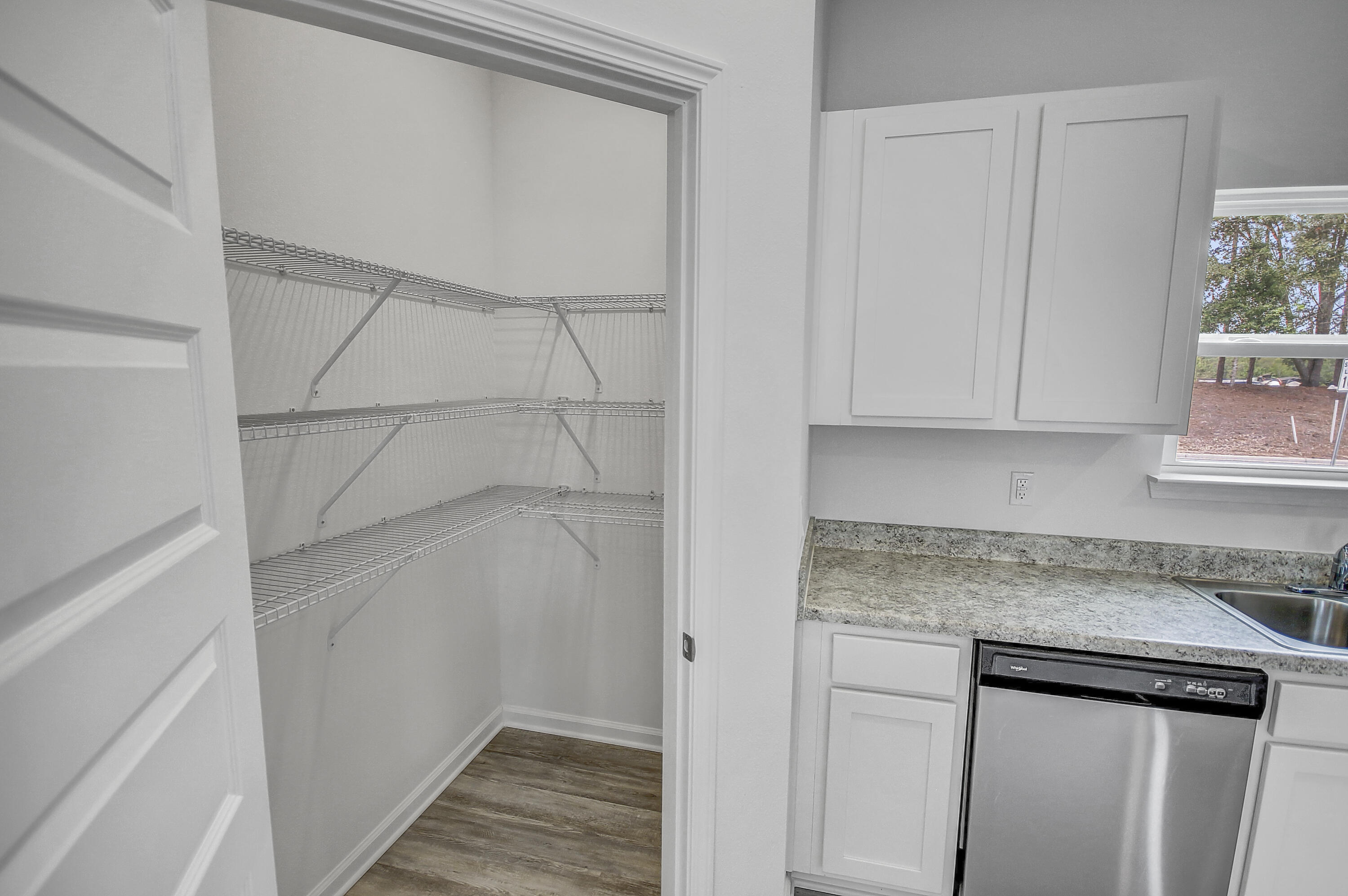 247 Staggerbush Street Freeport, FL 32439 - Photo 12 of 36 a view of cabinets and wooden floor