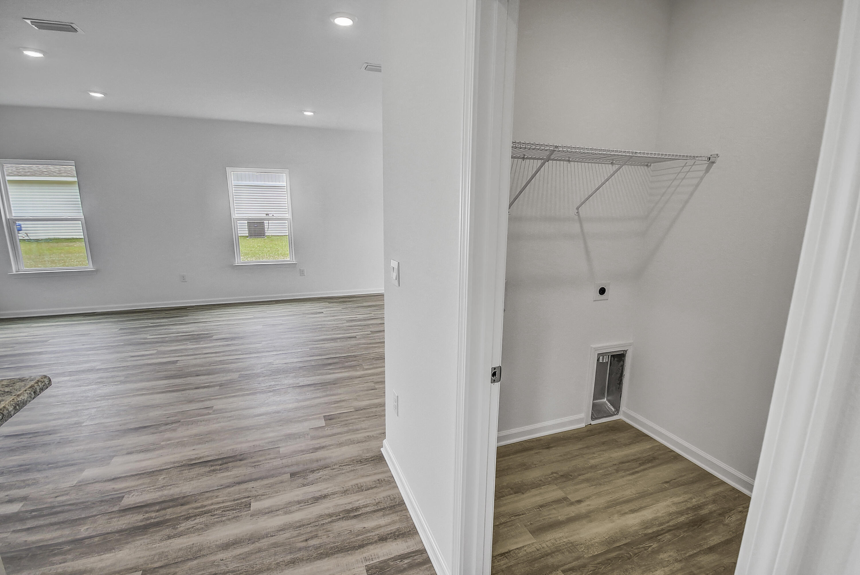 247 Staggerbush Street Freeport, FL 32439 - Photo 13 of 36 a view of hallway with wooden floor