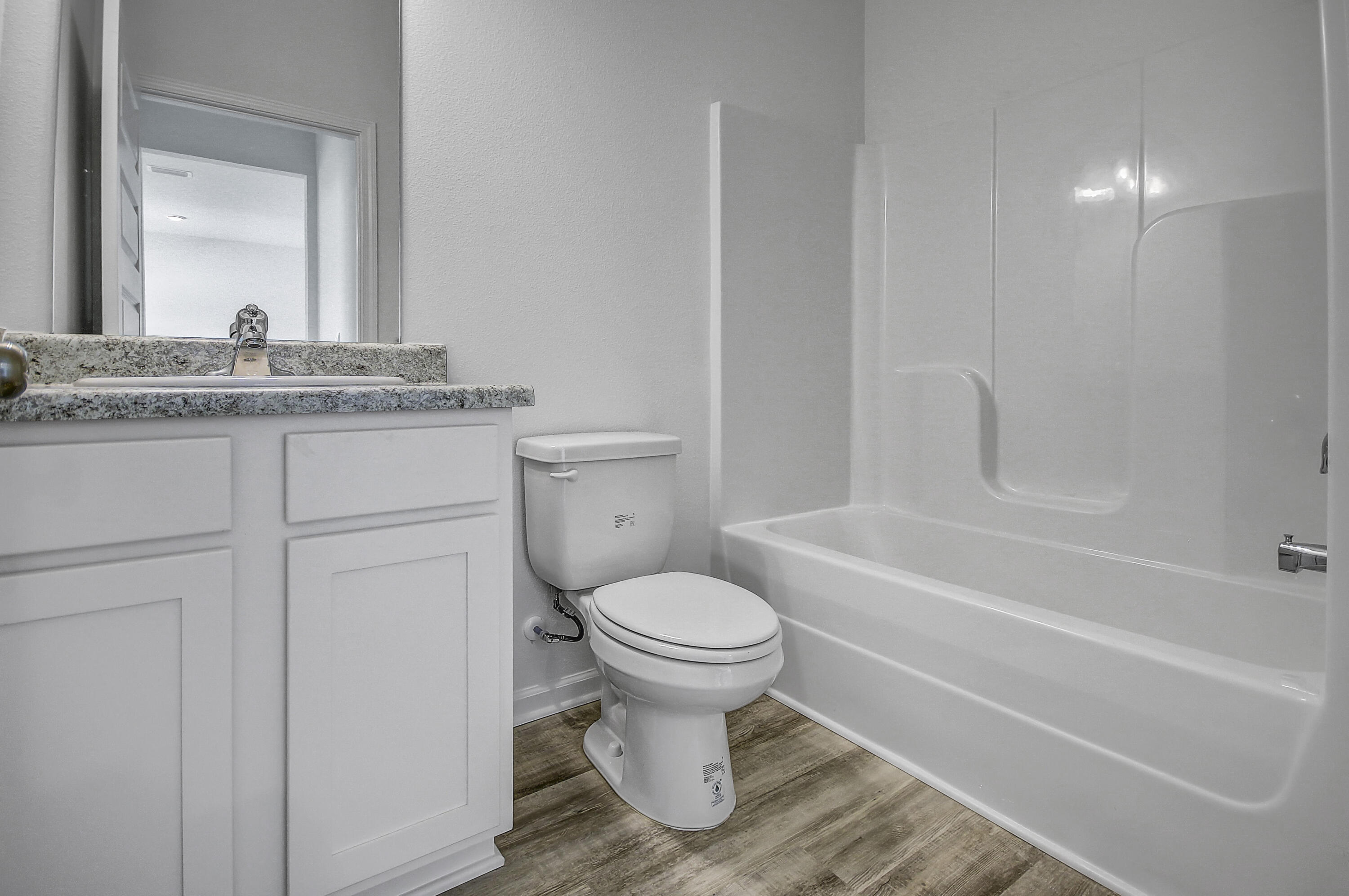 247 Staggerbush Street Freeport, FL 32439 - Photo 17 of 36 a bathroom with a toilet sink and mirror