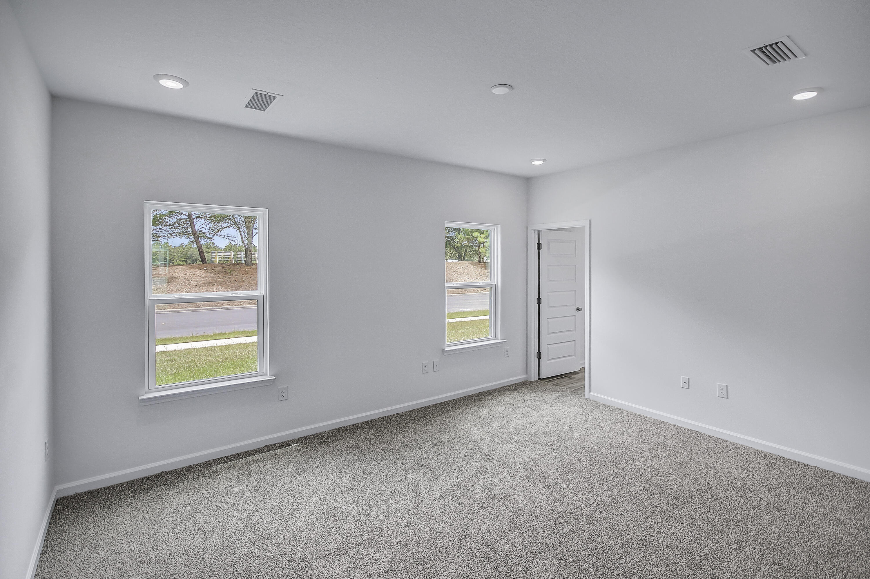 247 Staggerbush Street Freeport, FL 32439 - Photo 19 of 36 an empty room with windows