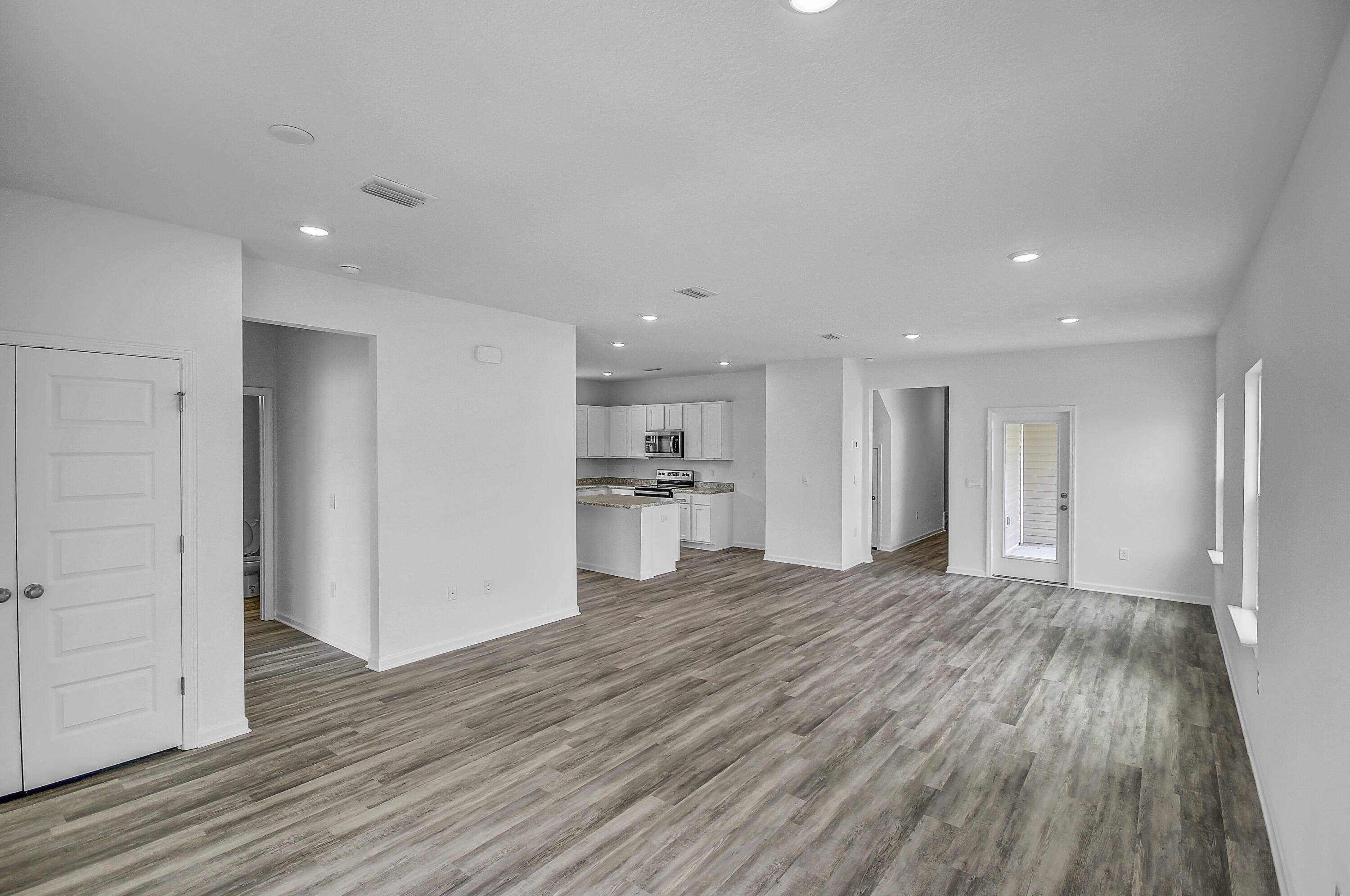 247 Staggerbush Street Freeport, FL 32439 - Photo 2 of 36 a view of a kitchen with wooden floor and a sink