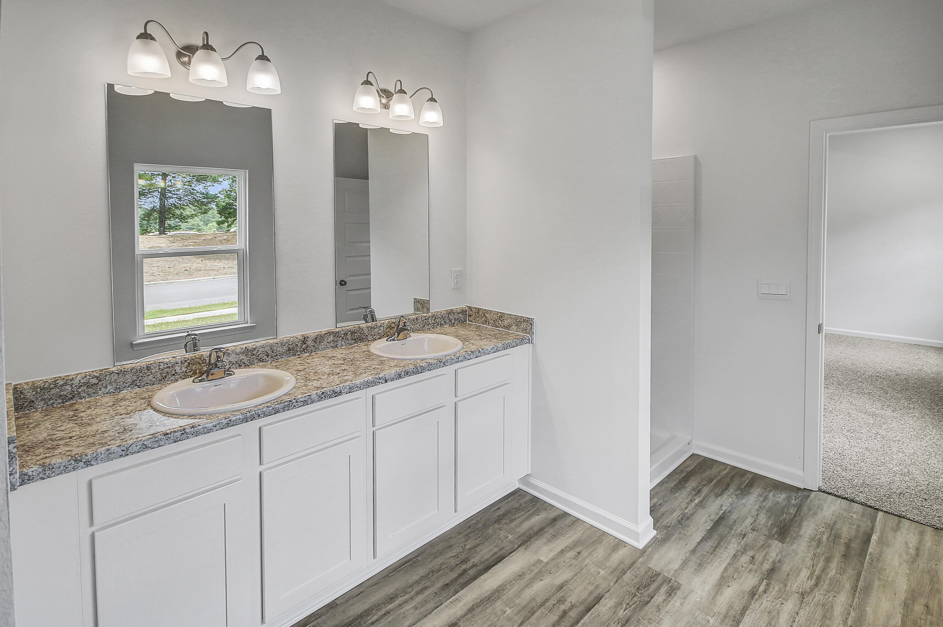 247 Staggerbush Street Freeport, FL 32439 - Photo 21 of 36 a bathroom with a sink and a mirror