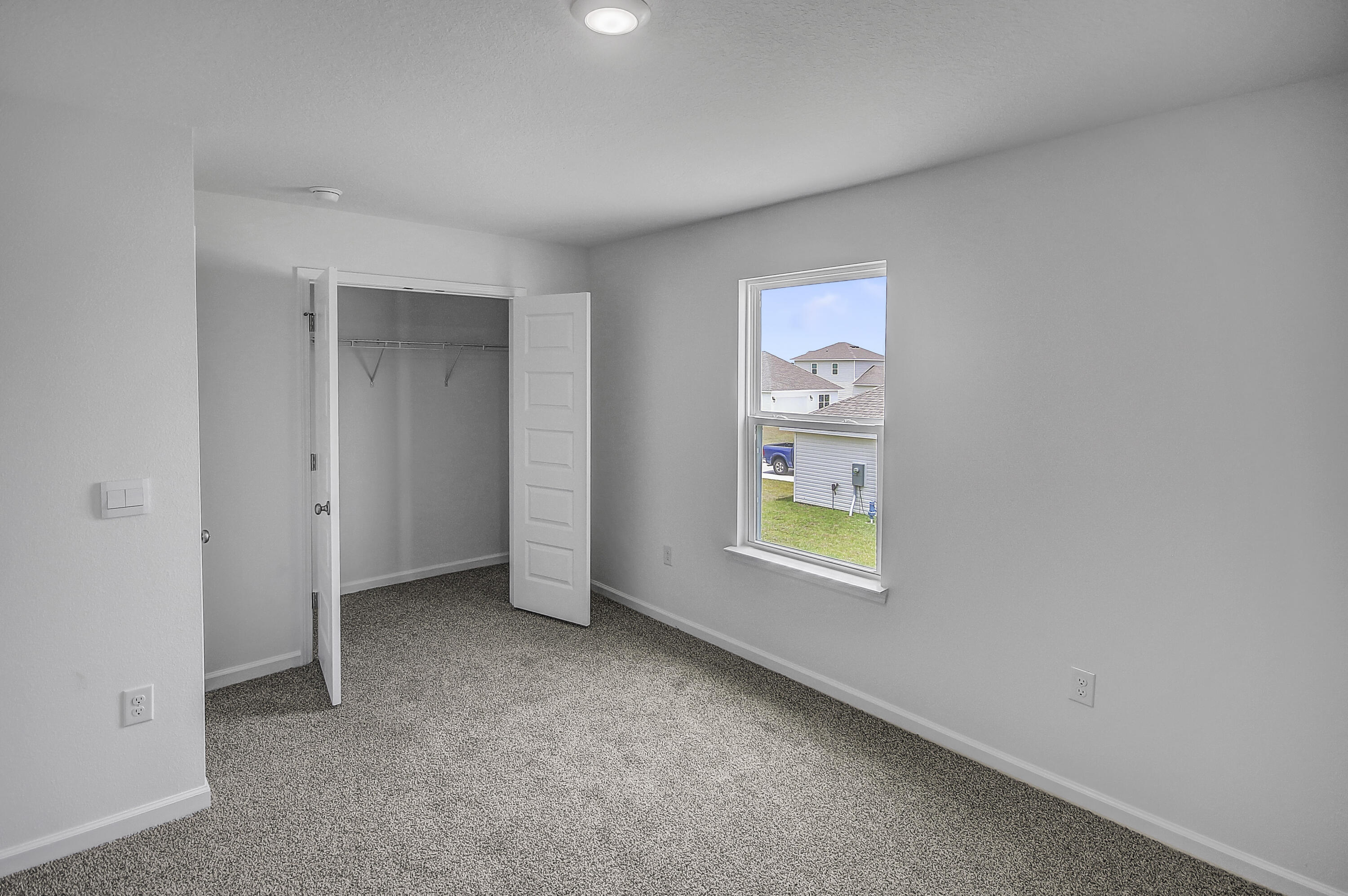 247 Staggerbush Street Freeport, FL 32439 - Photo 25 of 36 an empty room with windows