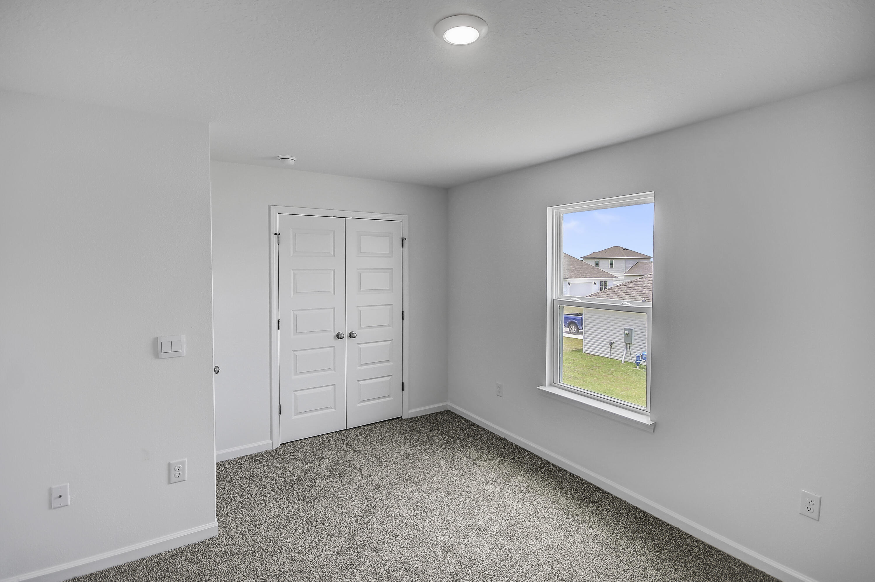 247 Staggerbush Street Freeport, FL 32439 - Photo 26 of 36 an empty room with windows