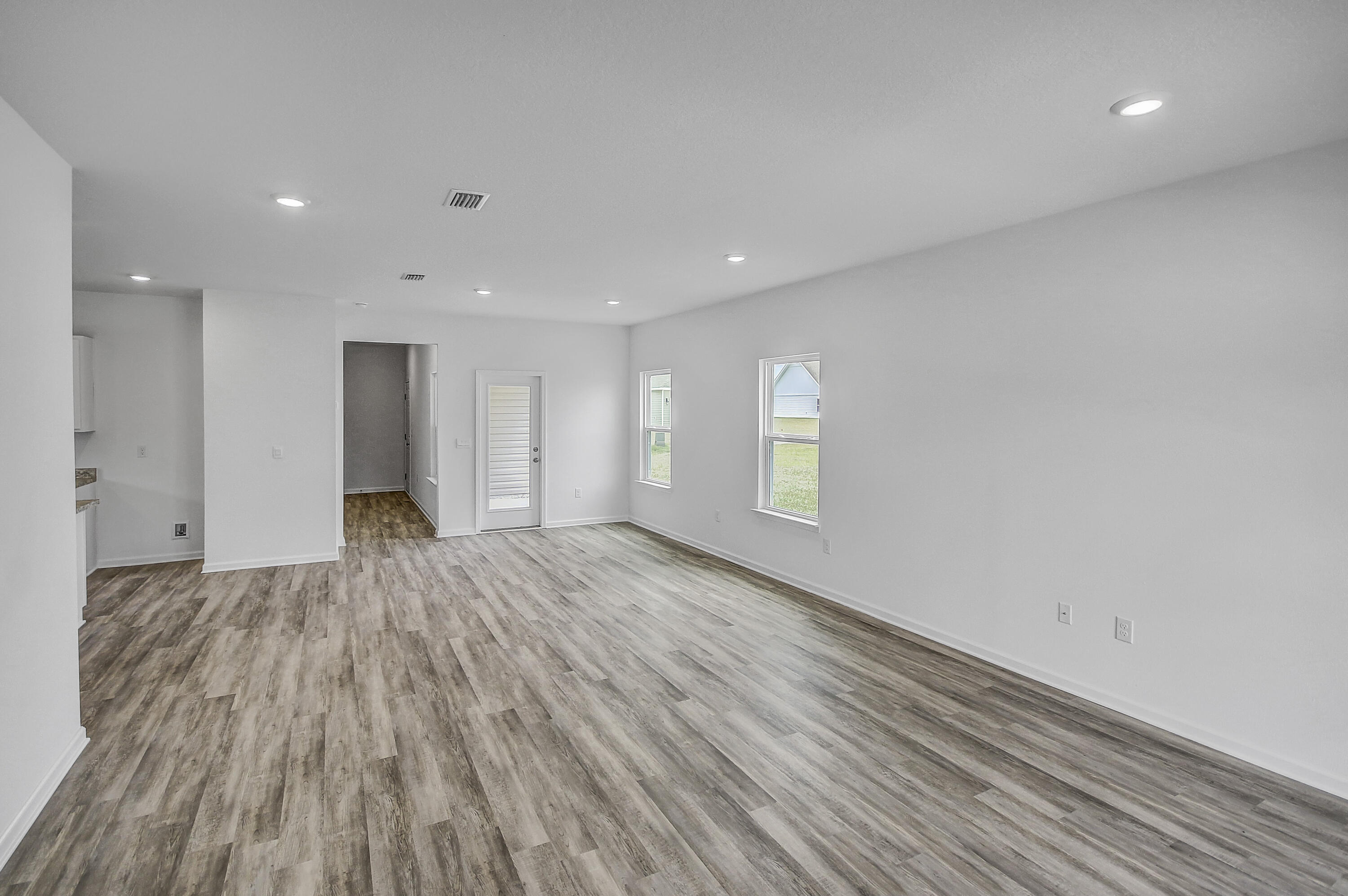 247 Staggerbush Street Freeport, FL 32439 - Photo 3 of 36 a view of an empty room and window
