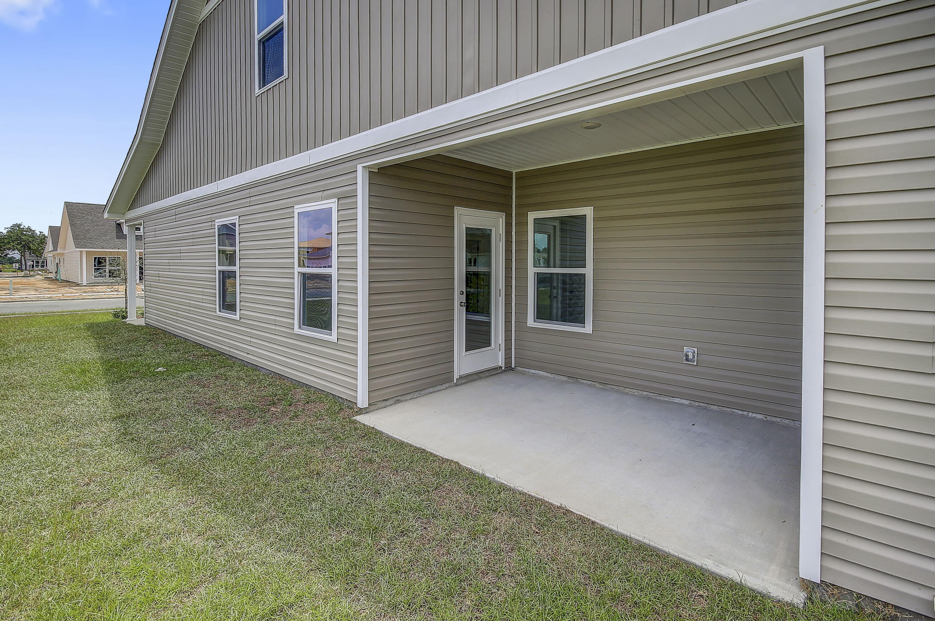 247 Staggerbush Street Freeport, FL 32439 - Photo 31 of 36 a view of a house with a yard and garage