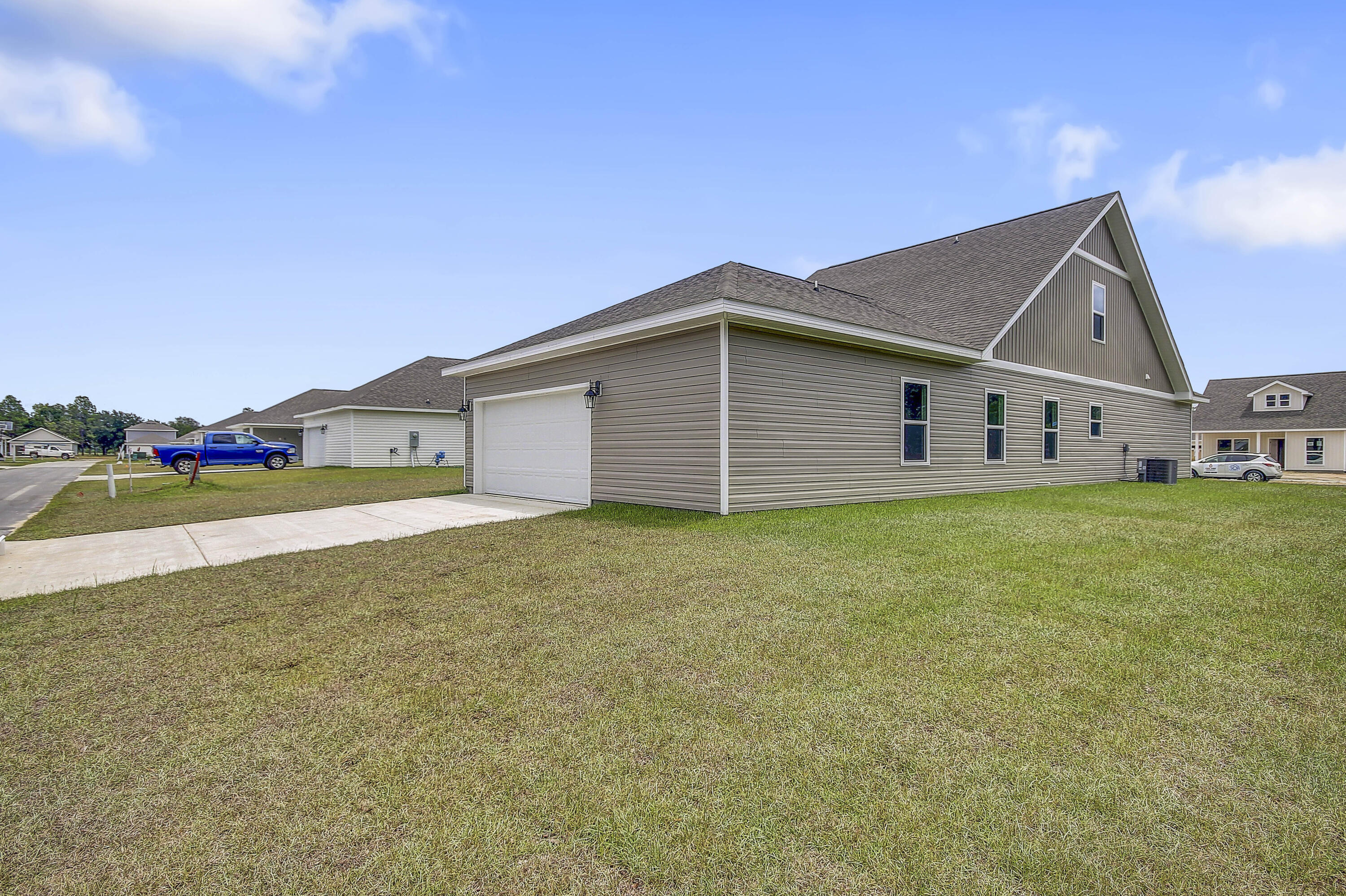 247 Staggerbush Street Freeport, FL 32439 - Photo 33 of 36 a view of a house with a backyard