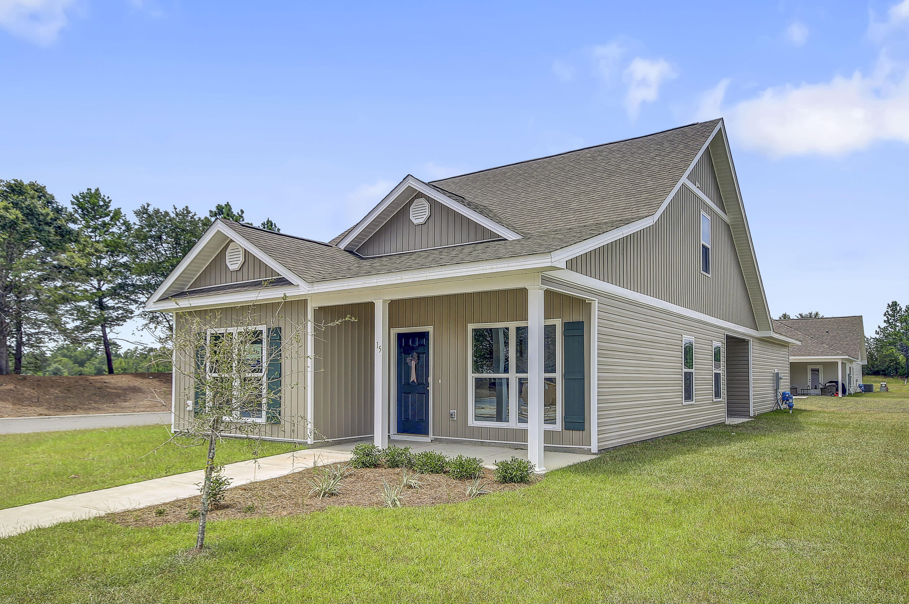 247 Staggerbush Street Freeport, FL 32439 - Photo 35 of 36 a view of a house with a yard and garden