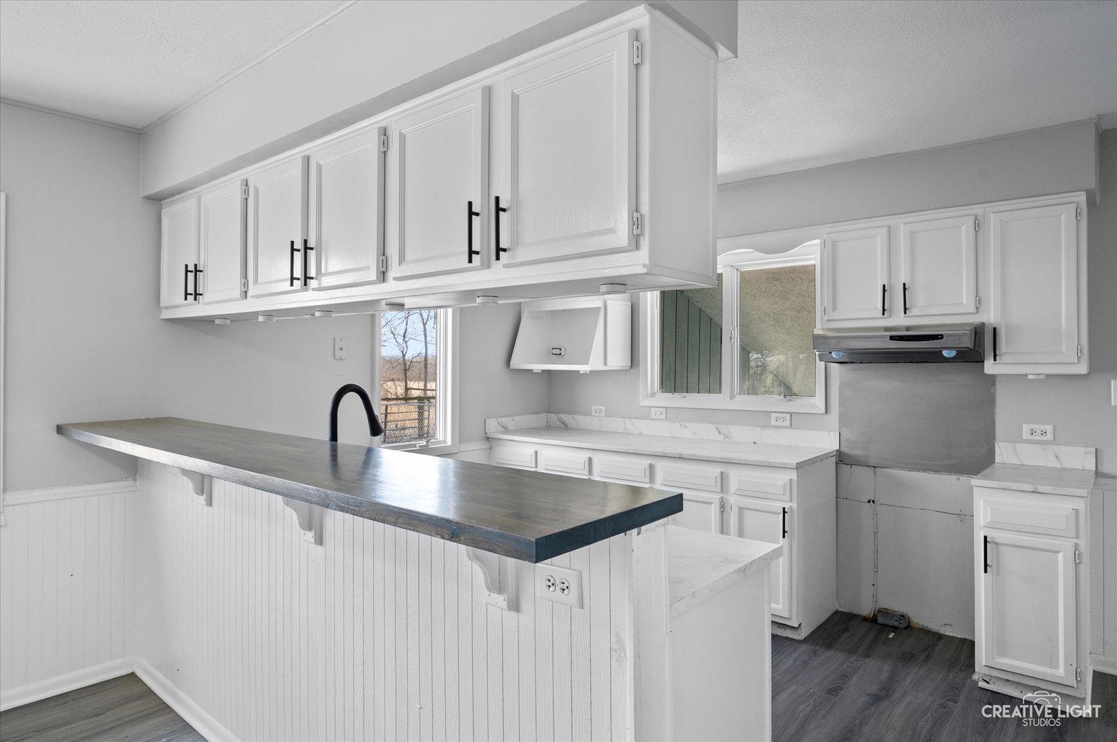 2391 North 24th Road Marseilles, IL 61341 - Photo 8 of 24 a kitchen with stainless steel appliances granite countertop a sink a refrigerator and white cabinets