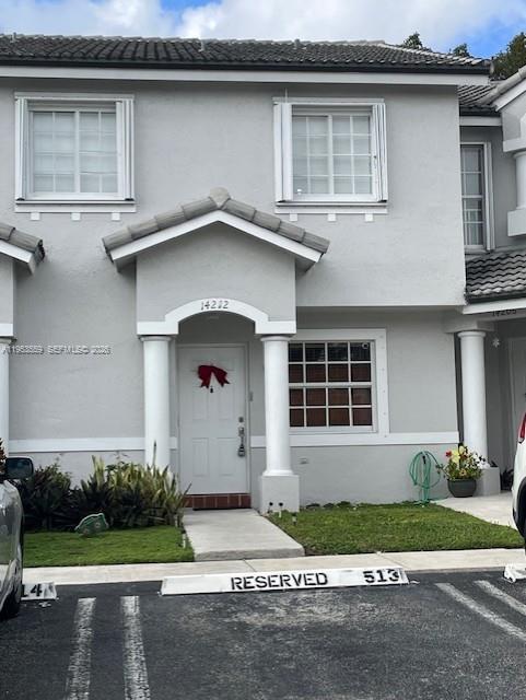 14212 Southwest 121st Place, Unit 6 Miami, FL 33186 - Photo 1 of 19 a house with a outdoor space