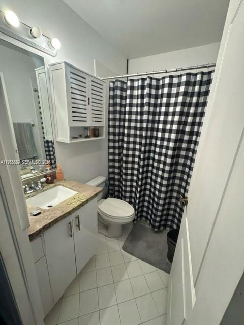 14212 Southwest 121st Place, Unit 6 Miami, FL 33186 - Photo 16 of 19 a bathroom with a sink toilet and shower