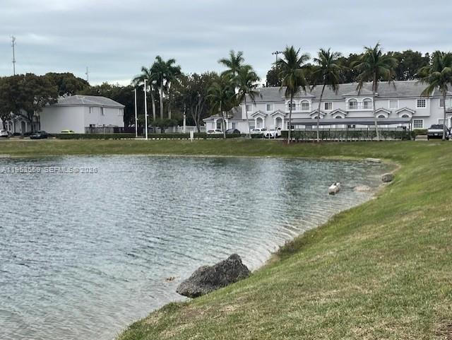 14212 Southwest 121st Place, Unit 6 Miami, FL 33186 - Photo 6 of 19 a view of a lake with houses