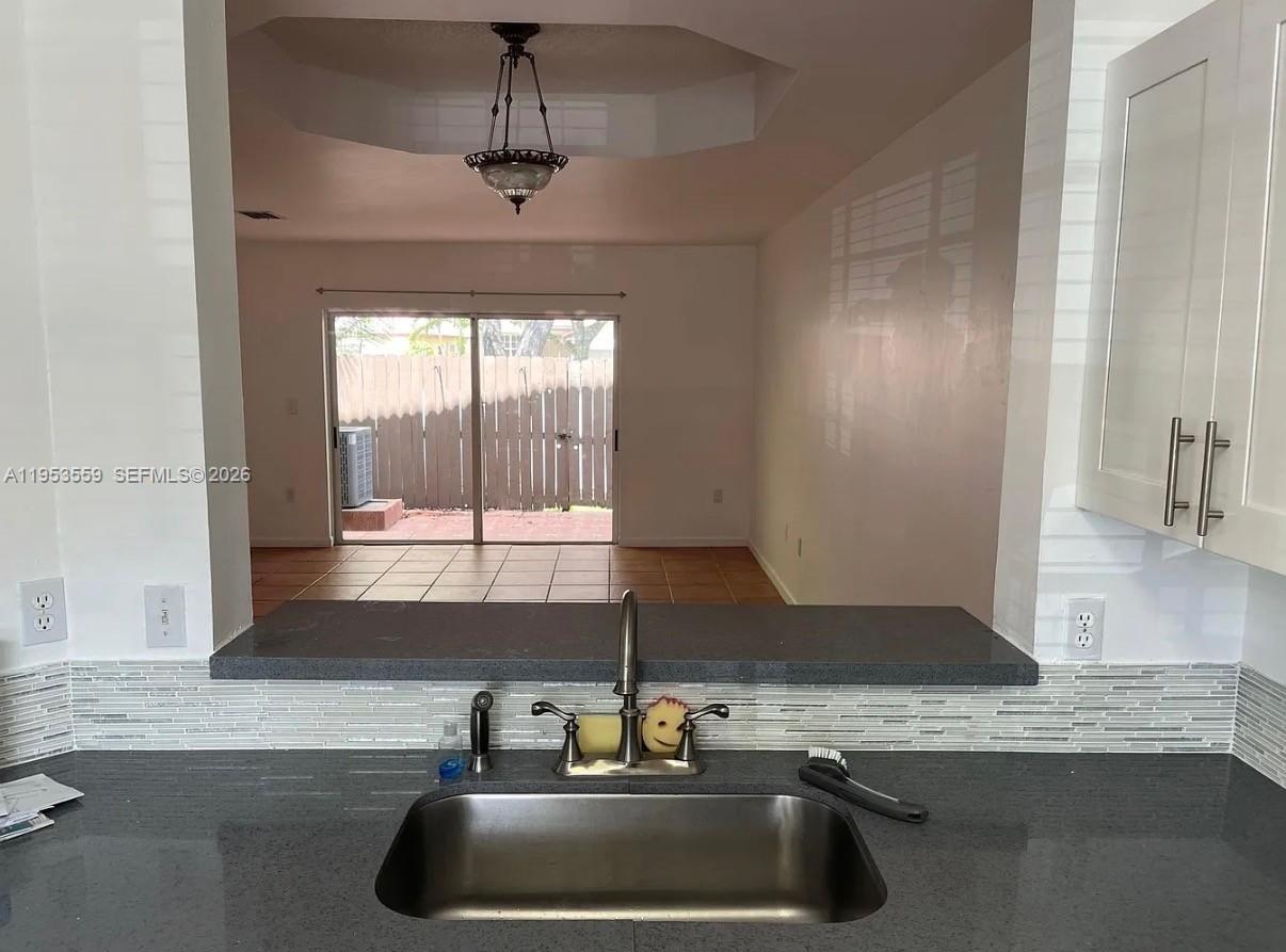 14212 Southwest 121st Place, Unit 6 Miami, FL 33186 - Photo 10 of 19 a kitchen with a sink and a window