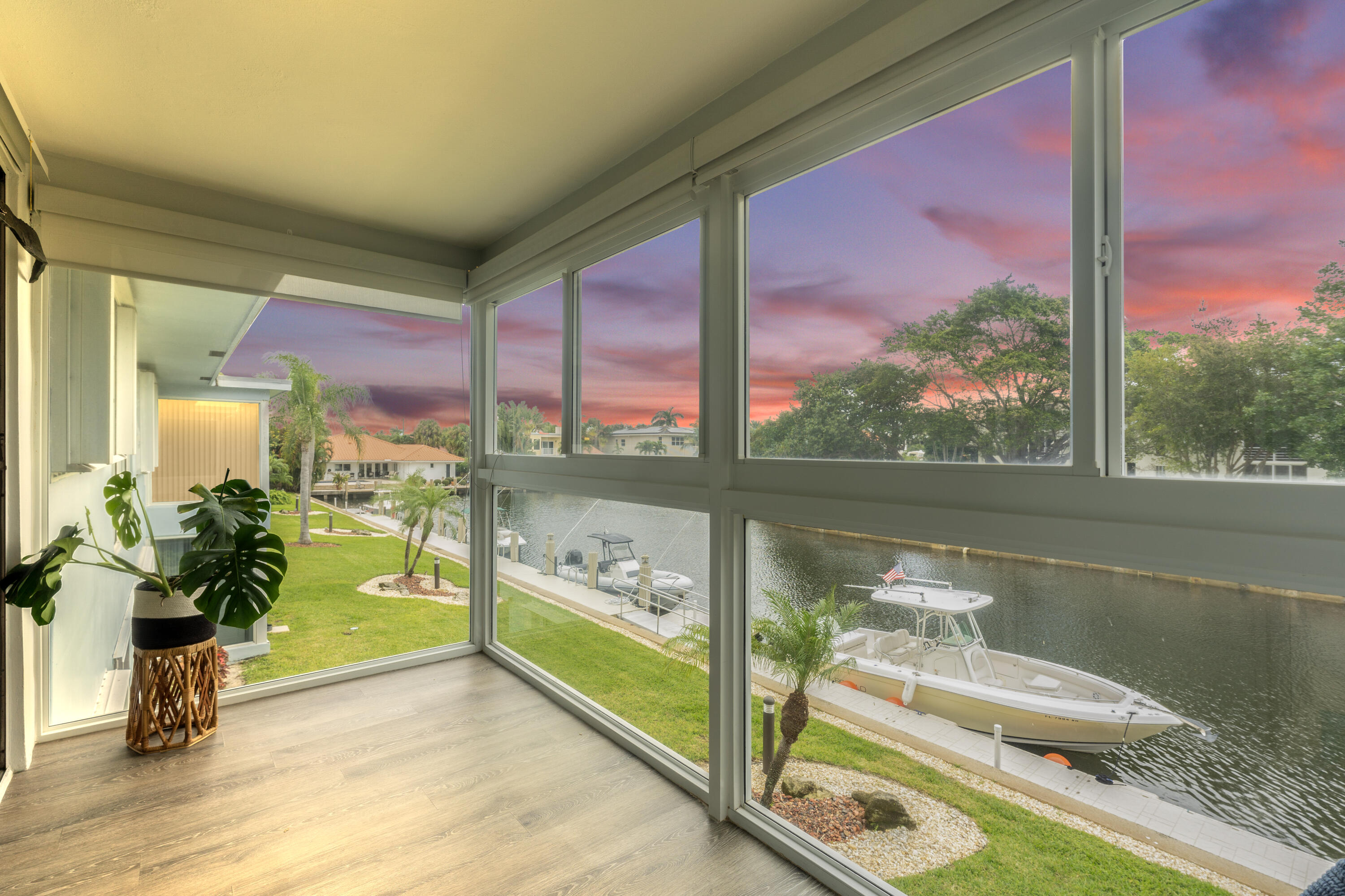 6100 Northeast 7th Avenue, Unit 20 Boca Raton, FL 33487 - Photo 1 of 42 a front view of a house with a yard