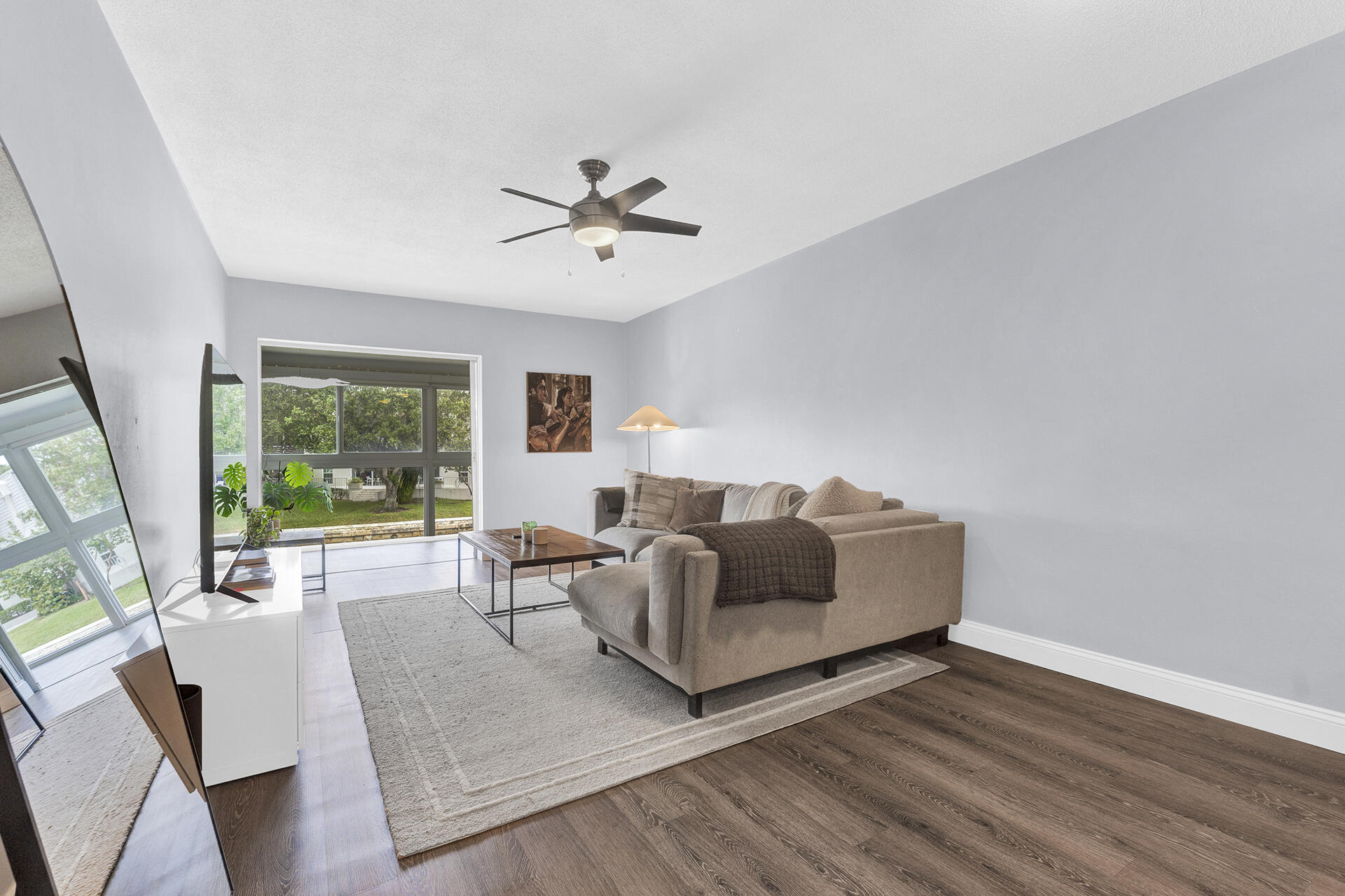 6100 Northeast 7th Avenue, Unit 20 Boca Raton, FL 33487 - Photo 18 of 42 a living room with furniture and a large window