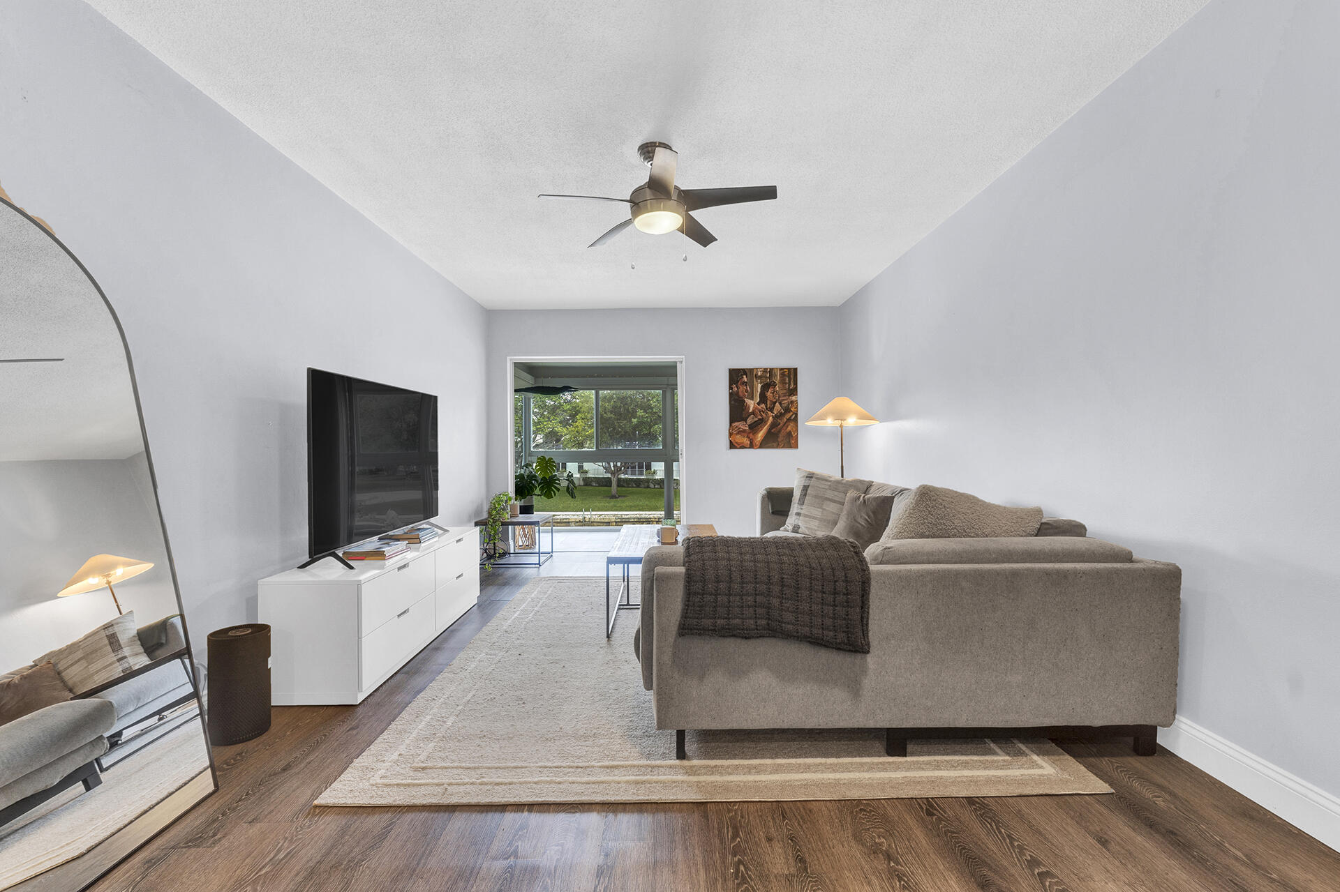 6100 Northeast 7th Avenue, Unit 20 Boca Raton, FL 33487 - Photo 21 of 42 a living room with furniture and a flat screen tv