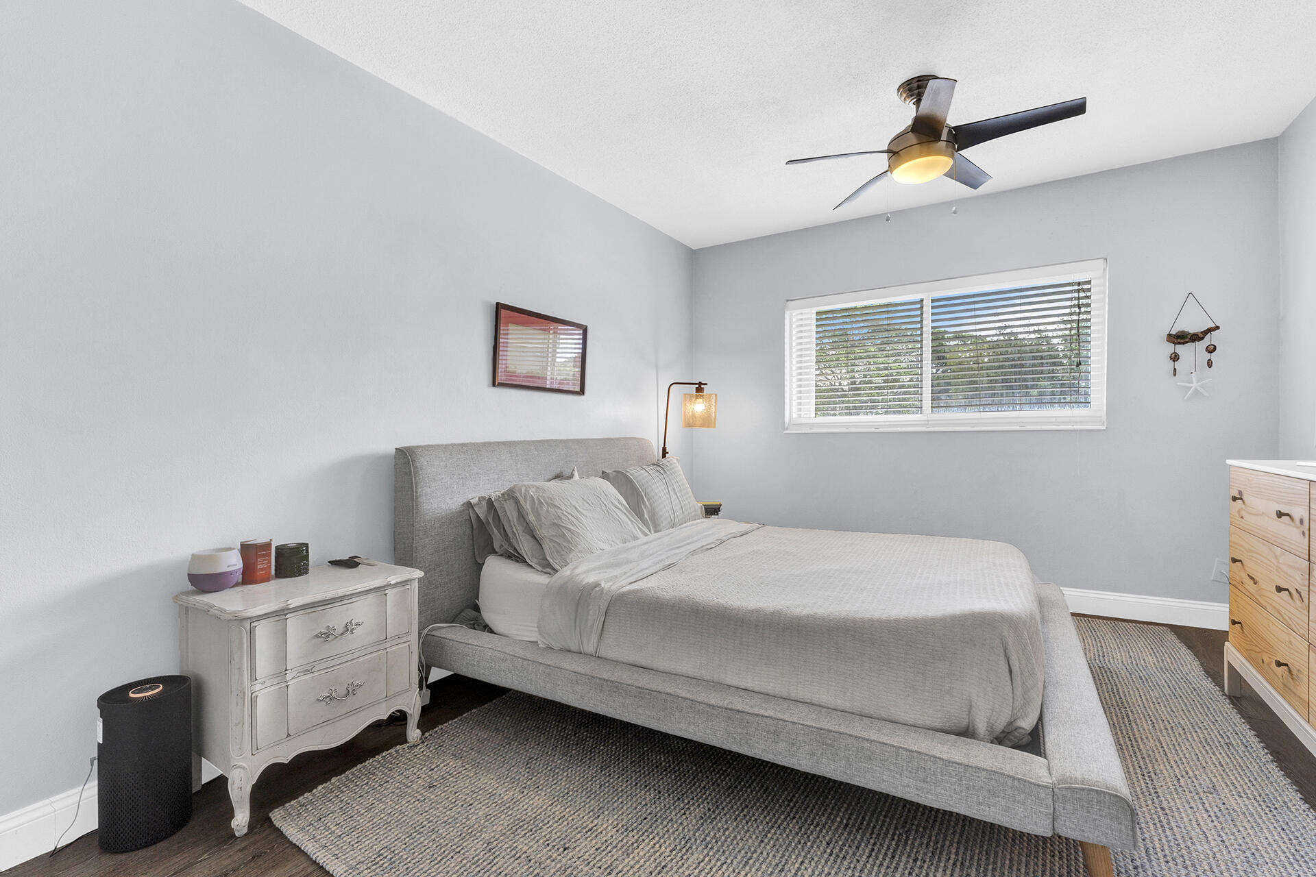 6100 Northeast 7th Avenue, Unit 20 Boca Raton, FL 33487 - Photo 25 of 42 a bedroom with a bed and a dresser