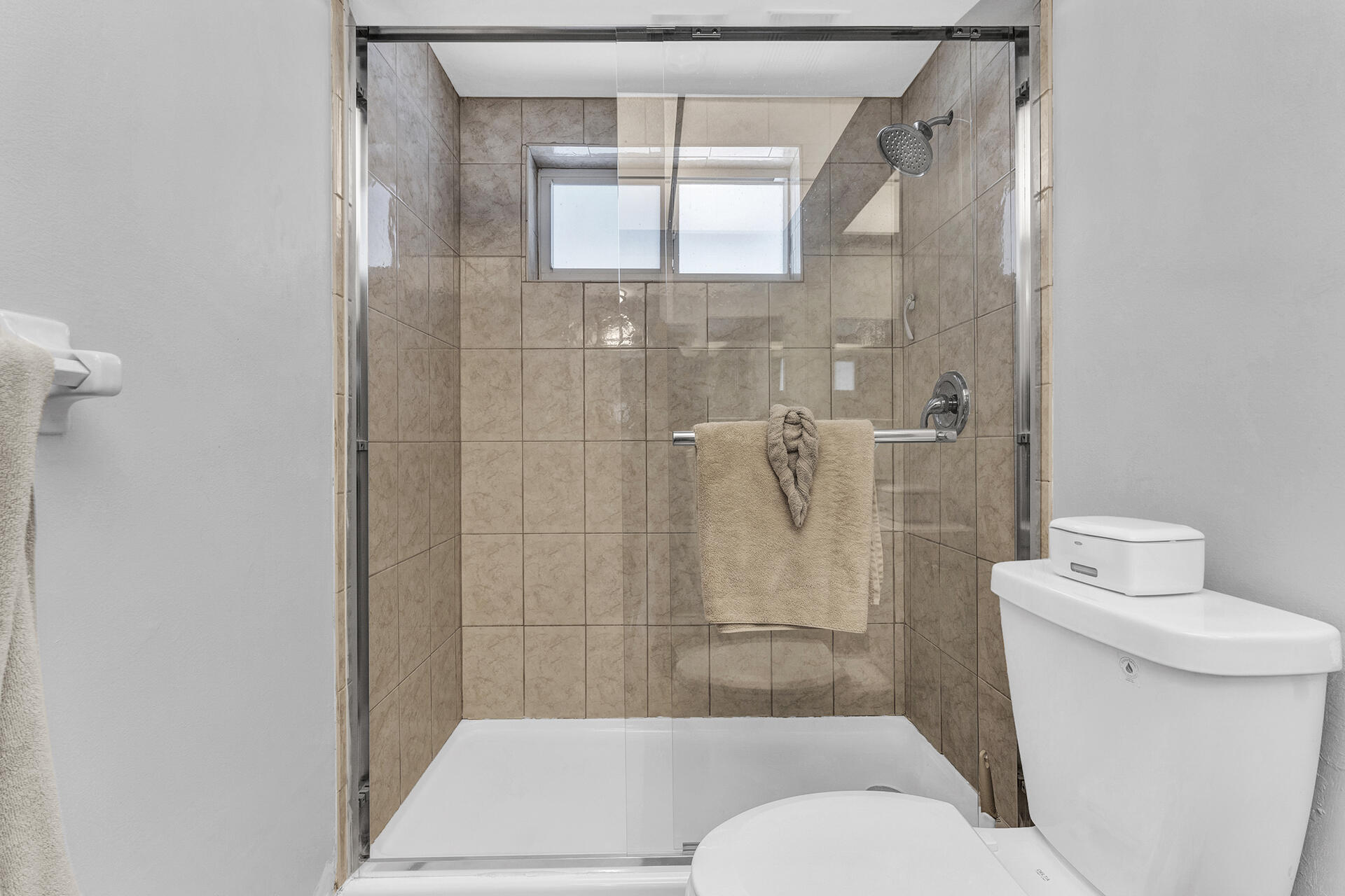 6100 Northeast 7th Avenue, Unit 20 Boca Raton, FL 33487 - Photo 30 of 42 a bathroom with a toilet and a shower
