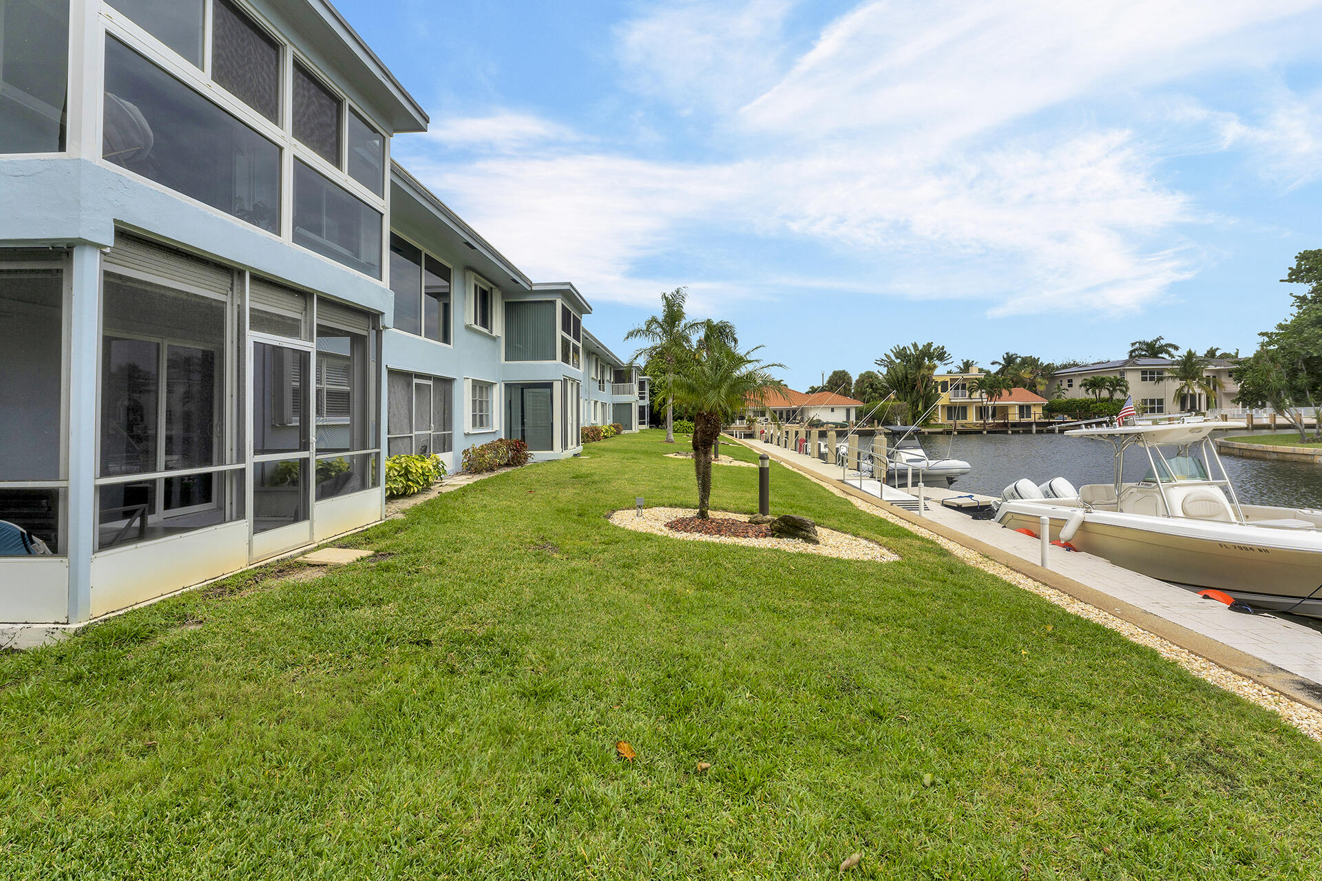 6100 Northeast 7th Avenue, Unit 20 Boca Raton, FL 33487 - Photo 34 of 42 a view of a house with a yard and sitting area