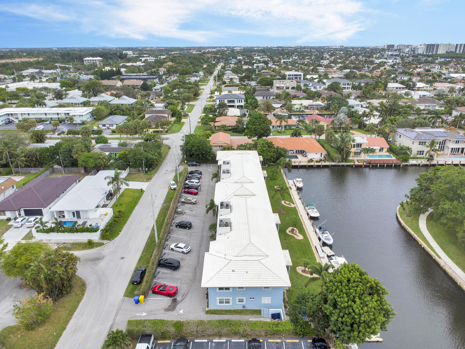 6100 Northeast 7th Avenue, Unit 20 Boca Raton, FL 33487 - Photo 39 of 42 an aerial view of a city with lots of residential buildings ocean and mountain view in back
