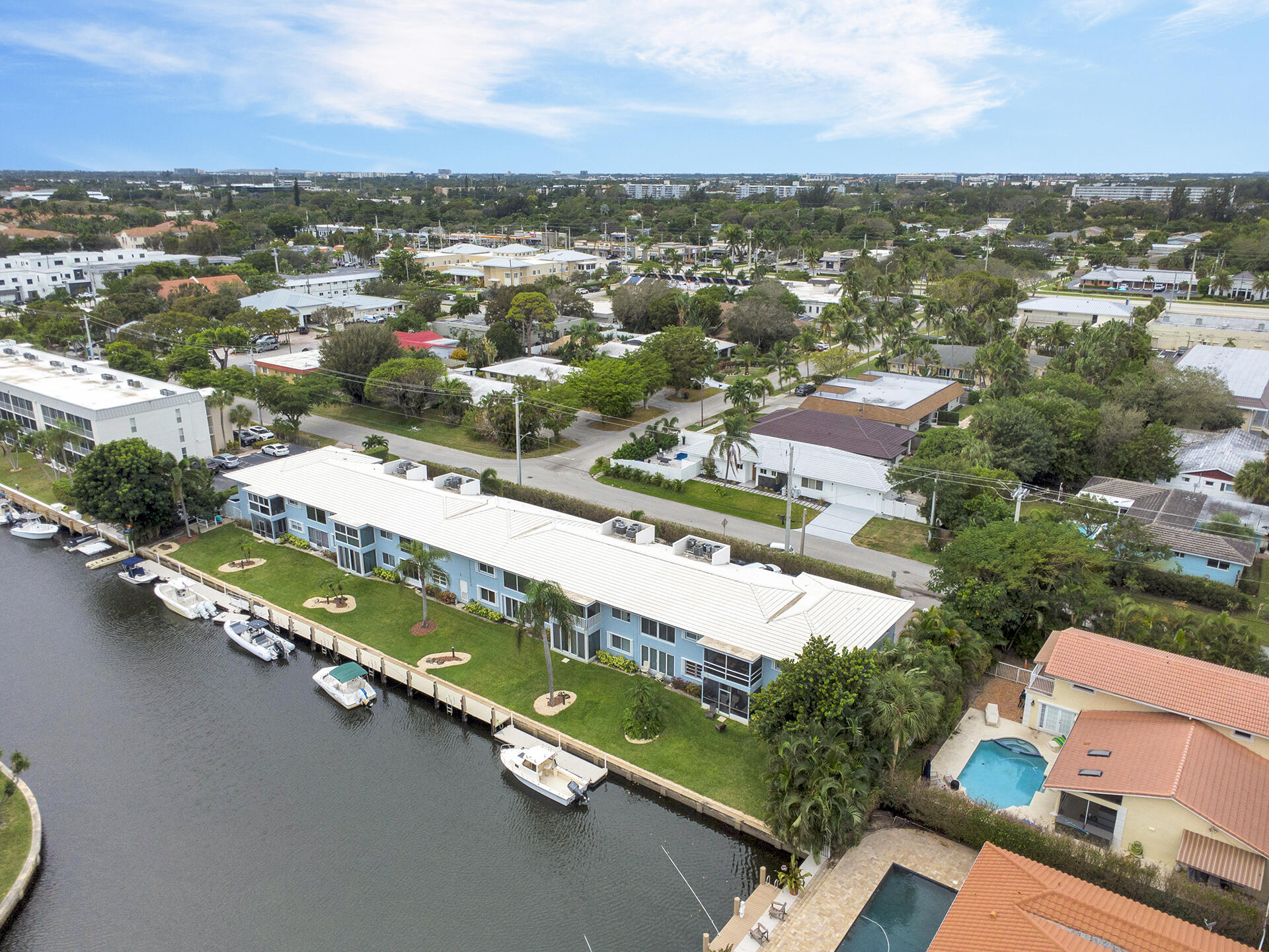 6100 Northeast 7th Avenue, Unit 20 Boca Raton, FL 33487 - Photo 40 of 42 an aerial view of residential houses with outdoor space and ocean view