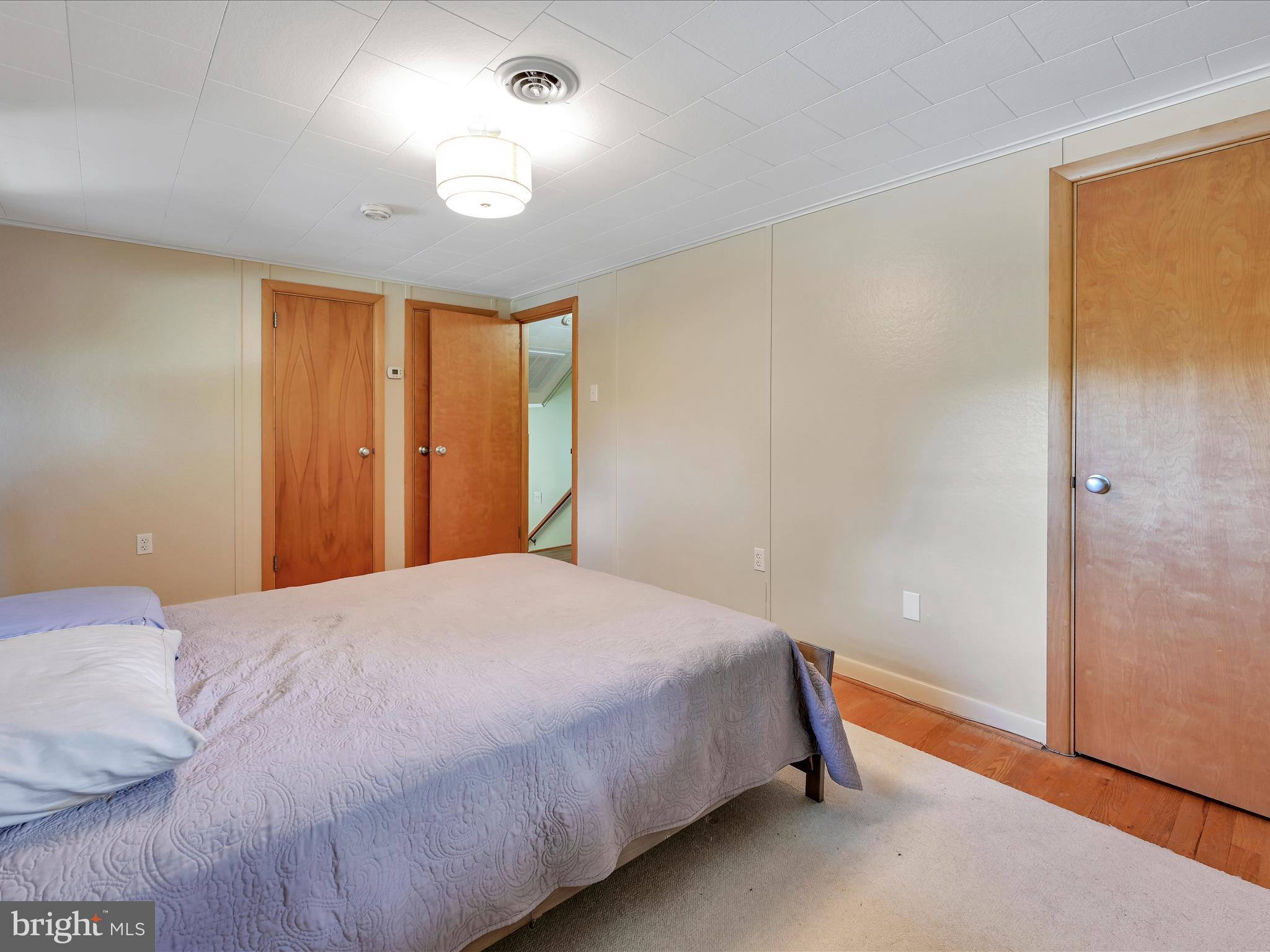 49 Sylvania Road Hershey, PA 17033 - Photo 18 of 29 a bedroom with a bed and a table