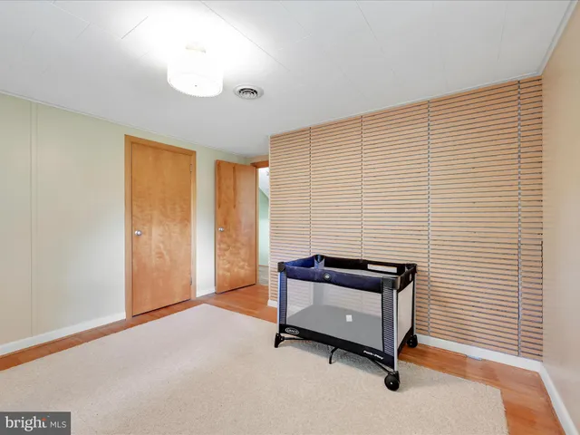 a view of a room with furniture and a window