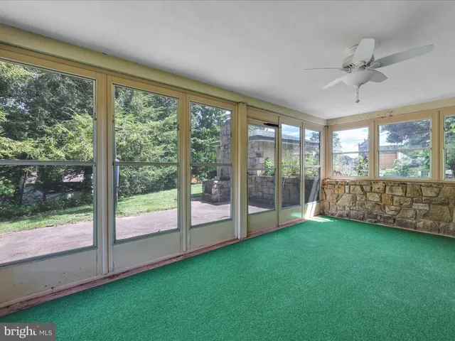 a view of a room with window and a yard