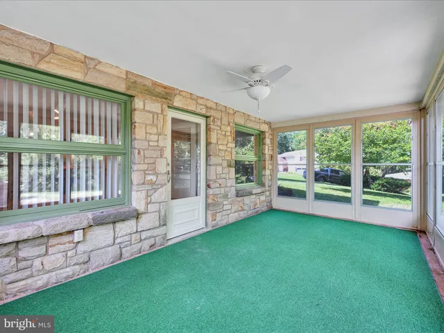 a view of a house with a yard and a garden