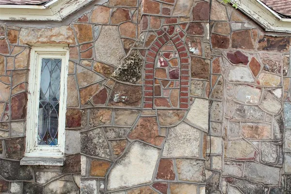 a brick building with a glass door shower