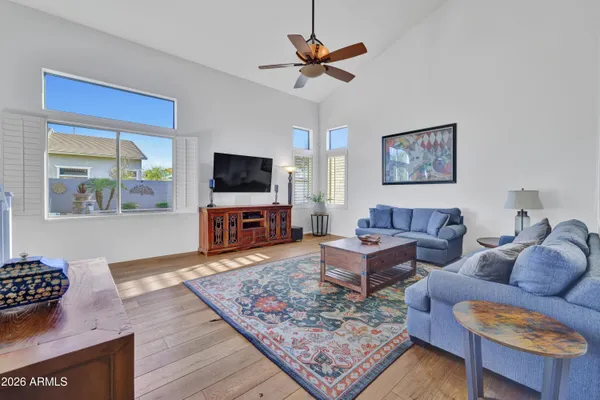 a living room with furniture and a large window