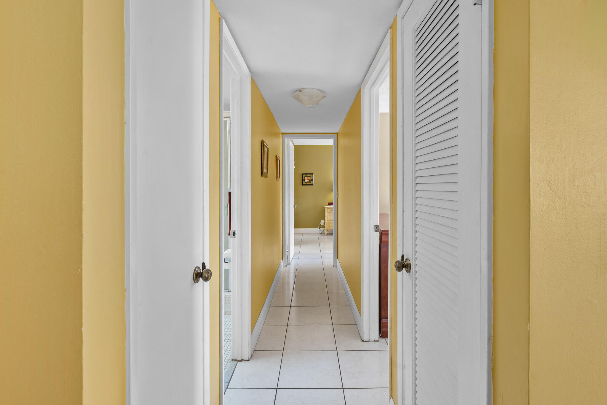 4047 Northwest 16th Street, Unit 206 Lauderhill, FL 33313 - Photo 13 of 26 a view of a hallway with a glass door and a window