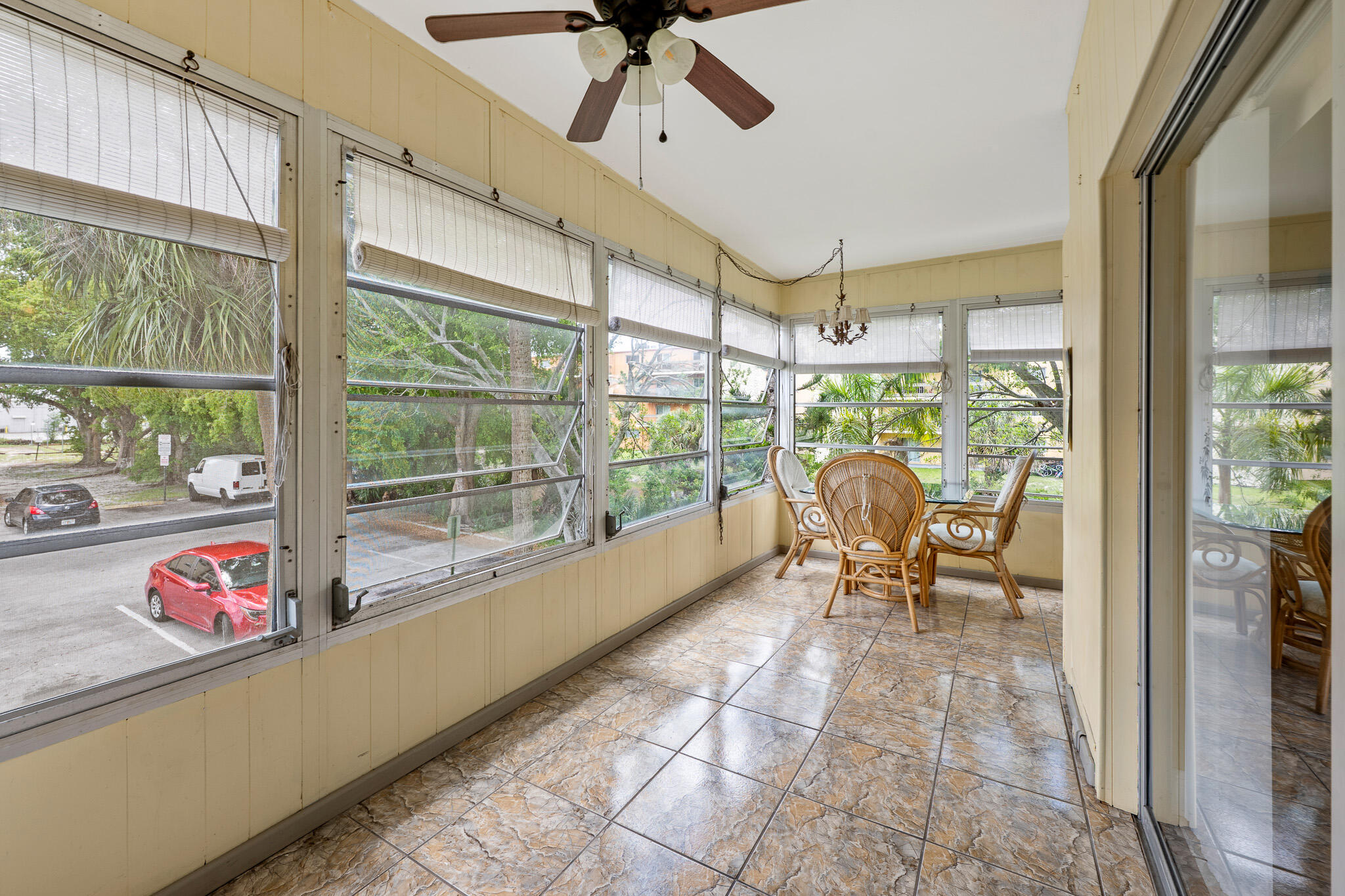 4047 Northwest 16th Street, Unit 206 Lauderhill, FL 33313 - Photo 21 of 26 a dining room with furniture water view and a floor to ceiling window