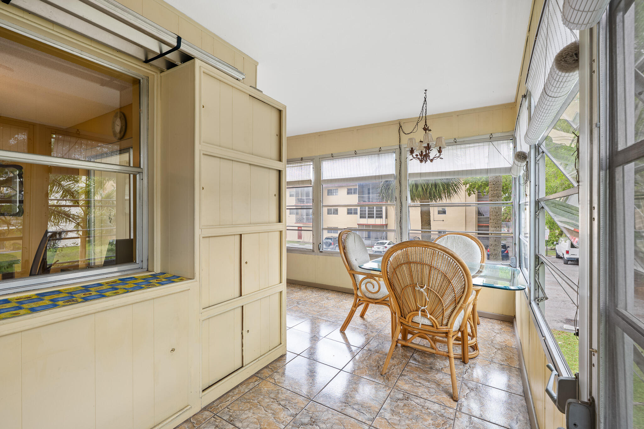 4047 Northwest 16th Street, Unit 206 Lauderhill, FL 33313 - Photo 26 of 26 a dining room with furniture and a window