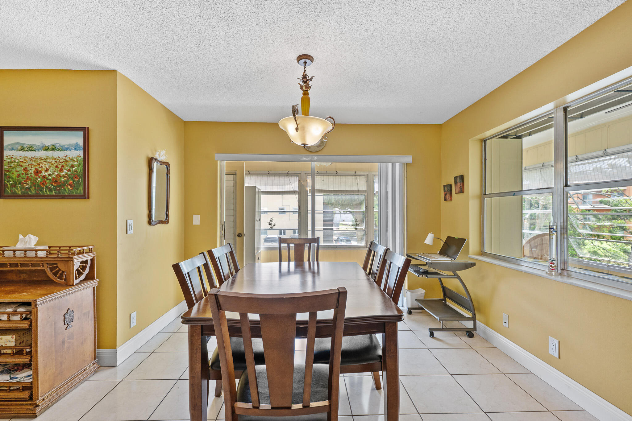 4047 Northwest 16th Street, Unit 206 Lauderhill, FL 33313 - Photo 9 of 26 a view of a dining room with furniture window and outside view