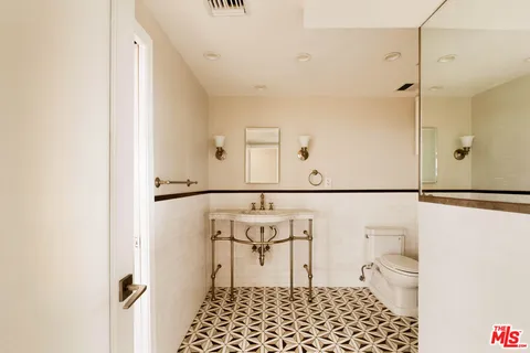 a bathroom with a shower and a toilet