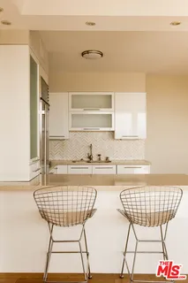 a kitchen with cabinets and appliances