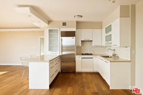 a view of a storage & utility room with wooden floor