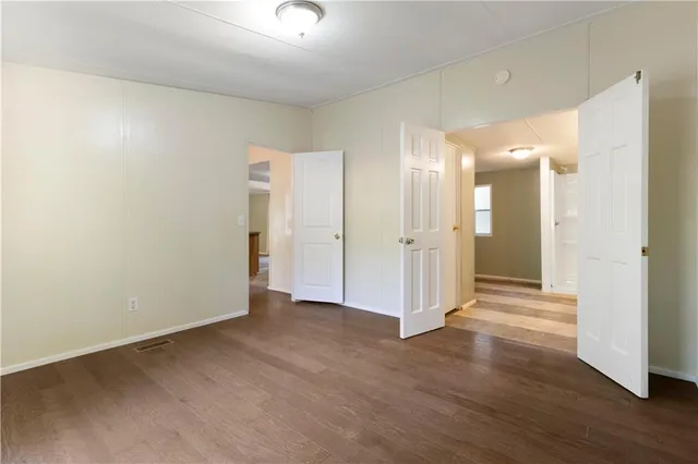 a bathroom with a double vanity sink and mirror