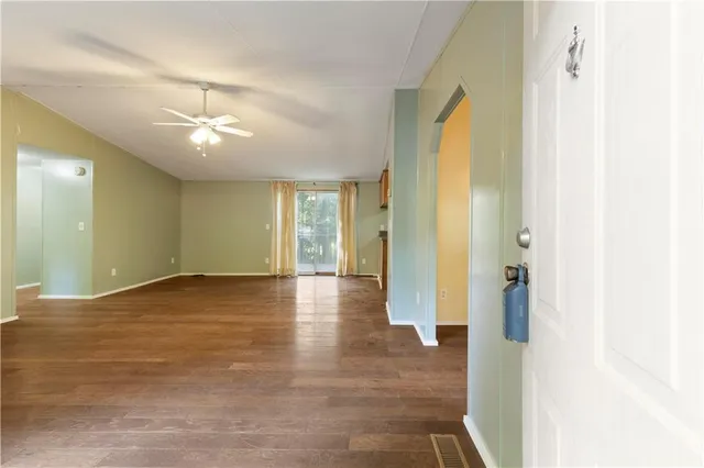 a living room with furniture potted plant and a window
