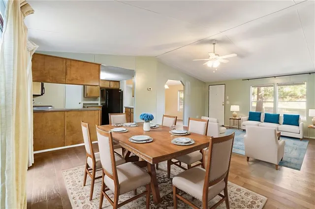 a kitchen with stainless steel appliances granite countertop a refrigerator stove and sink