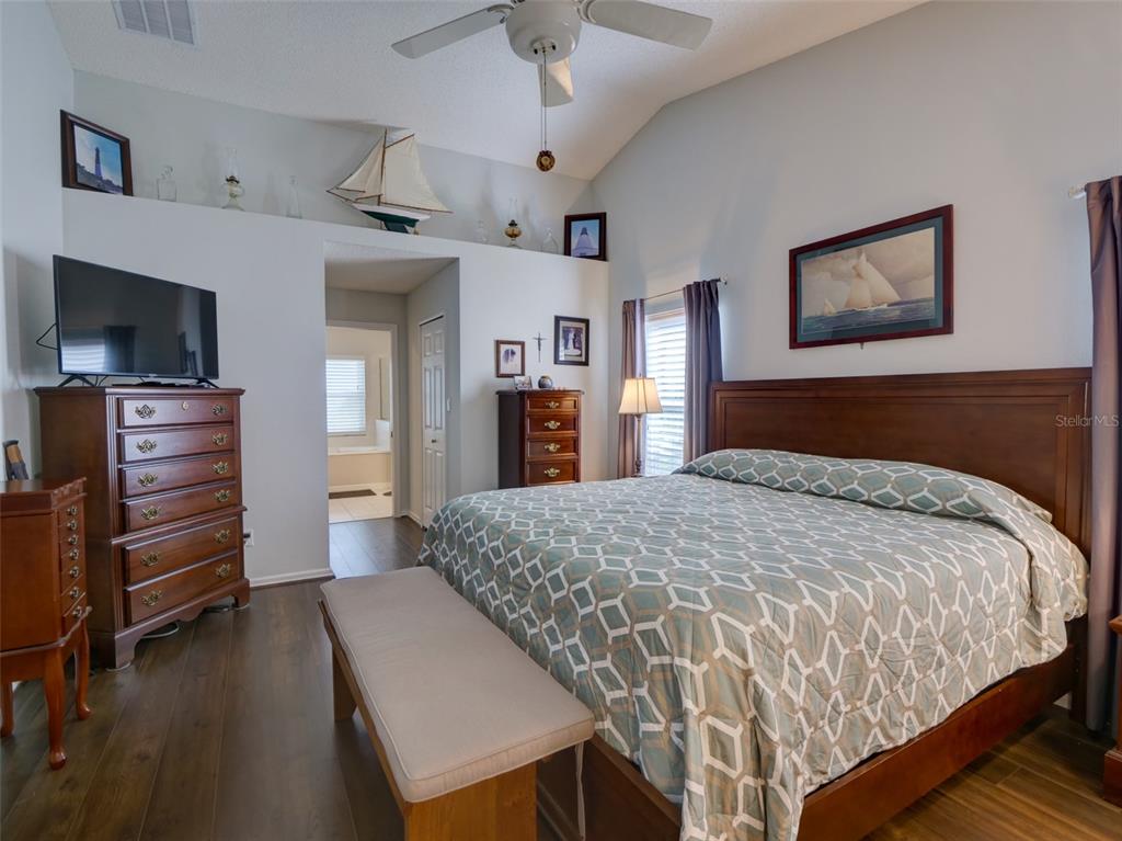 4704 River Ridge Drive Leesburg, FL 34748 - Photo 18 of 40 a bedroom with a bed and a television