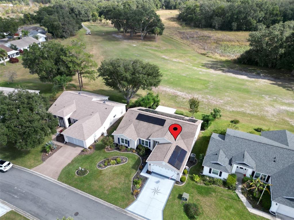 4704 River Ridge Drive Leesburg, FL 34748 - Photo 2 of 40 an aerial view of a house with a yard and lake view