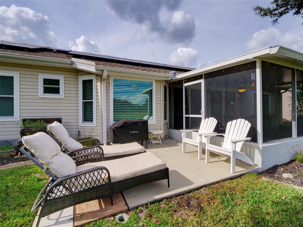4704 River Ridge Drive Leesburg, FL 34748 - Photo 30 of 40 a outdoor living space with furniture and garden view